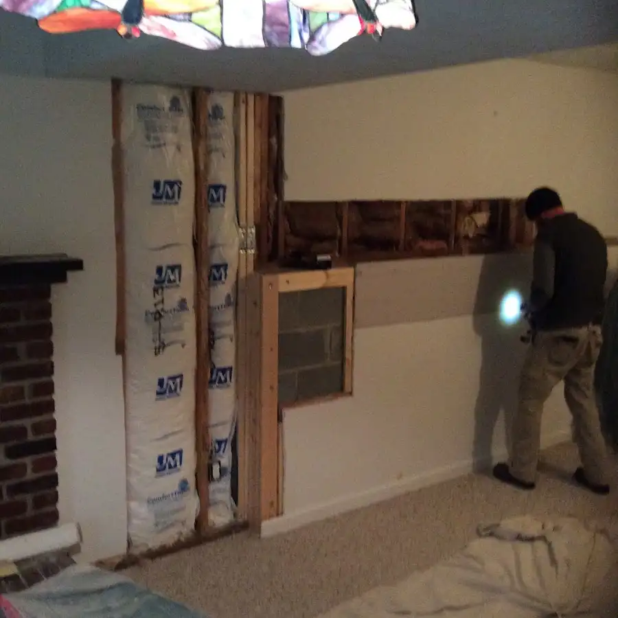 Restoration technician inspecting water damage in Waimanalo